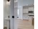 View of kitchen with stainless steel appliances and partial bathroom including white pedestal sink at 1899 Deco Dr, Kennesaw, GA 30144