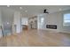 Open-concept floor plan with a living area, fireplace and kitchen area at 1899 Deco Dr, Kennesaw, GA 30144
