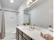 Bright bathroom with a long vanity, double sinks, and a shower/tub combo at 625 Home Se Ave, Atlanta, GA 30312
