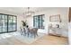 Elegant dining room features large windows, stylish lighting, and modern decor creating a perfect entertaining space at 625 Home Se Ave, Atlanta, GA 30312