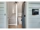 Open entryway with a staircase, light hardwood floors, and view of a mailbox at 625 Home Se Ave, Atlanta, GA 30312