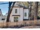 Charming two-story home with classic architecture, a picket fence, and mature trees at 625 Home Se Ave, Atlanta, GA 30312