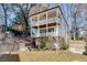 Charming two-story home features a double balcony and a well-maintained landscaped yard surrounded by mature trees at 625 Home Se Ave, Atlanta, GA 30312