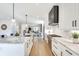 Bright, modern kitchen features white cabinets, marble countertops, stainless steel appliances, and an open concept design at 625 Home Se Ave, Atlanta, GA 30312
