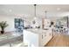 Open-concept kitchen with a large island, marble countertops, stainless steel appliances, and abundant natural light at 625 Home Se Ave, Atlanta, GA 30312