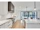 Stylish kitchen with white cabinetry, marble countertops, stainless steel appliances, and an open layout at 625 Home Se Ave, Atlanta, GA 30312