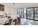 Modern kitchen island with bar seating, stainless steel appliances, and beautiful views of the outdoors at 625 Home Se Ave, Atlanta, GA 30312