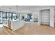 Modern kitchen with hardwood floors boasts a marble island, stainless steel appliances, and open access to the dining room at 625 Home Se Ave, Atlanta, GA 30312