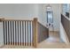 Bright staircase with light wood steps, black iron railings, and modern pendant lighting above at 625 Home Se Ave, Atlanta, GA 30312
