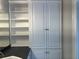 Bathroom featuring custom cabinets with shelving and closed storage, paired with a sleek countertop at 870 Thornberry Dr, Alpharetta, GA 30022