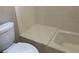 Cozy bathroom boasts tile walls and floors, plus a modern toilet at 870 Thornberry Dr, Alpharetta, GA 30022