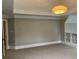 Comfortable bedroom with neutral carpeting, gray walls, recessed lighting, and access to another room, offering versatility at 870 Thornberry Dr, Alpharetta, GA 30022
