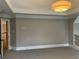 Spacious bedroom with neutral walls, plush carpeting, tray ceiling, and recessed lighting, creating a cozy retreat at 870 Thornberry Dr, Alpharetta, GA 30022