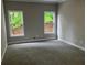 Bedroom with plush carpet and large windows allowing natural light at 870 Thornberry Dr, Alpharetta, GA 30022
