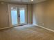 Bonus room featuring neutral carpet, and french doors leading to the exterior at 870 Thornberry Dr, Alpharetta, GA 30022