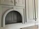 Custom kitchen cabinetry features molding and a unique arched storage niche at 870 Thornberry Dr, Alpharetta, GA 30022