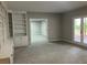 Open-concept living room boasts neutral paint, carpet and natural light at 870 Thornberry Dr, Alpharetta, GA 30022