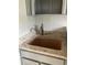 A home wet bar with stainless steel faucet and granite countertops at 870 Thornberry Dr, Alpharetta, GA 30022