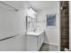 Modern bathroom with double mirrors, tile floors, and vanity sink at 1029 Megan Ct, Sugar Hill, GA 30518