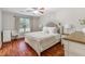 Bright bedroom features wood floors, ceiling fan, and neutral decor at 1029 Megan Ct, Sugar Hill, GA 30518