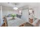 This dining room features a rustic table, statement lighting, and decor at 1029 Megan Ct, Sugar Hill, GA 30518