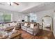 Spacious living room features hardwood floors, natural light, and comfortable seating at 1029 Megan Ct, Sugar Hill, GA 30518