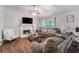 Inviting living room featuring a fireplace, comfortable seating, and a cozy atmosphere at 1029 Megan Ct, Sugar Hill, GA 30518