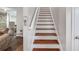 Staircase with hardwood steps that leads to other spaces within the home at 1029 Megan Ct, Sugar Hill, GA 30518