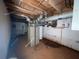 Unfinished basement with exposed pipes and equipment, offering potential for customization at 2988 Ramble Ln, Decatur, GA 30033