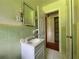 Bathroom showcases vintage tile, vanity, and fixtures at 2988 Ramble Ln, Decatur, GA 30033