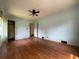 A bedroom featuring hardwood floors and windows at 2988 Ramble Ln, Decatur, GA 30033