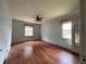 A primary bedroom with original hardwood floors and windows at 2988 Ramble Ln, Decatur, GA 30033