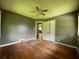 Spacious bedroom features hardwood floors, ceiling fan, and a convenient closet for storage at 2988 Ramble Ln, Decatur, GA 30033