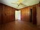 Bedroom featuring hardwood floors and wood paneled walls at 2988 Ramble Ln, Decatur, GA 30033