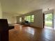 View of the living room with hardwood floors and chandelier at 2988 Ramble Ln, Decatur, GA 30033