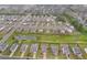 Community aerial view featuring well-maintained homes, lush green spaces, and a pond, showcasing a desirable residential area at 59 Summer Nw Pl, Cartersville, GA 30121