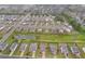 This aerial view shows a pond and green space between newer single Gathering homes in a residential neighborhood at 59 Summer Nw Pl, Cartersville, GA 30121