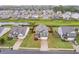 Aerial view showcases well-maintained yards, mature trees, and neighboring houses in the community at 59 Summer Nw Pl, Cartersville, GA 30121