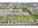 This aerial shot highlights backyards, a pond, and green space between newer single Gathering homes in a residential neighborhood at 59 Summer Nw Pl, Cartersville, GA 30121