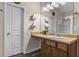 Charming bathroom featuring a wood-grain vanity with a drop-in sink and a large mirror at 59 Summer Nw Pl, Cartersville, GA 30121