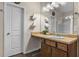 Bathroom with single sink vanity, updated fixtures, and tiled shower with glass door at 59 Summer Nw Pl, Cartersville, GA 30121