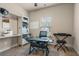 Neutral bedroom features a desk area, sewing machine, a large window, and a music keyboard at 59 Summer Nw Pl, Cartersville, GA 30121