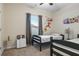 Charming bedroom with twin beds and playful decor, perfect for children or guests at 59 Summer Nw Pl, Cartersville, GA 30121