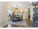 Open dining room featuring a modern chandelier, stylish rug, and lots of natural light at 59 Summer Nw Pl, Cartersville, GA 30121