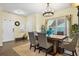 Bright dining room featuring a wooden table, upholstered chairs, and a contemporary chandelier at 59 Summer Nw Pl, Cartersville, GA 30121