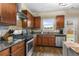Spacious kitchen with stainless steel appliances, granite countertops, and ample storage for culinary enthusiasts at 59 Summer Nw Pl, Cartersville, GA 30121