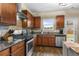 Gourmet kitchen boasting stainless steel appliances, granite countertops, and a stylish backsplash at 59 Summer Nw Pl, Cartersville, GA 30121