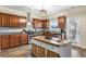 Bright kitchen with stainless appliances, a center island, granite counters and wood cabinets at 59 Summer Nw Pl, Cartersville, GA 30121