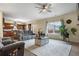 Open concept living room with a ceiling fan, neutral walls, and a large window at 59 Summer Nw Pl, Cartersville, GA 30121