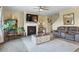 Inviting living room boasts a fireplace, ceiling fan, and a plush rug, perfect for relaxing and entertaining at 59 Summer Nw Pl, Cartersville, GA 30121